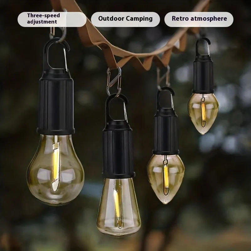 Five solar powered lantern style outdoor light bulbs with warm white LED lighting