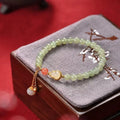 Qingshui jade women's bracelet with gold-plated gourd charm and fu character
