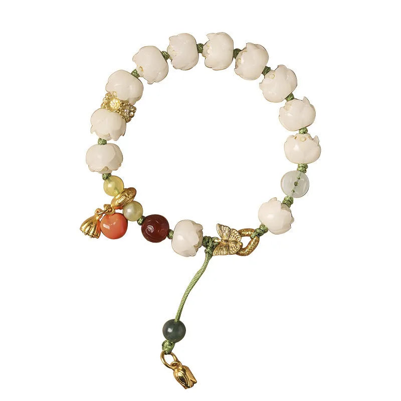 Hand-woven white jade bodhi bracelet showing pumpkin and lotus beads on adjustable open rope