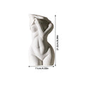 White porcelain figurative human vase with 21.2cm height on a shelf