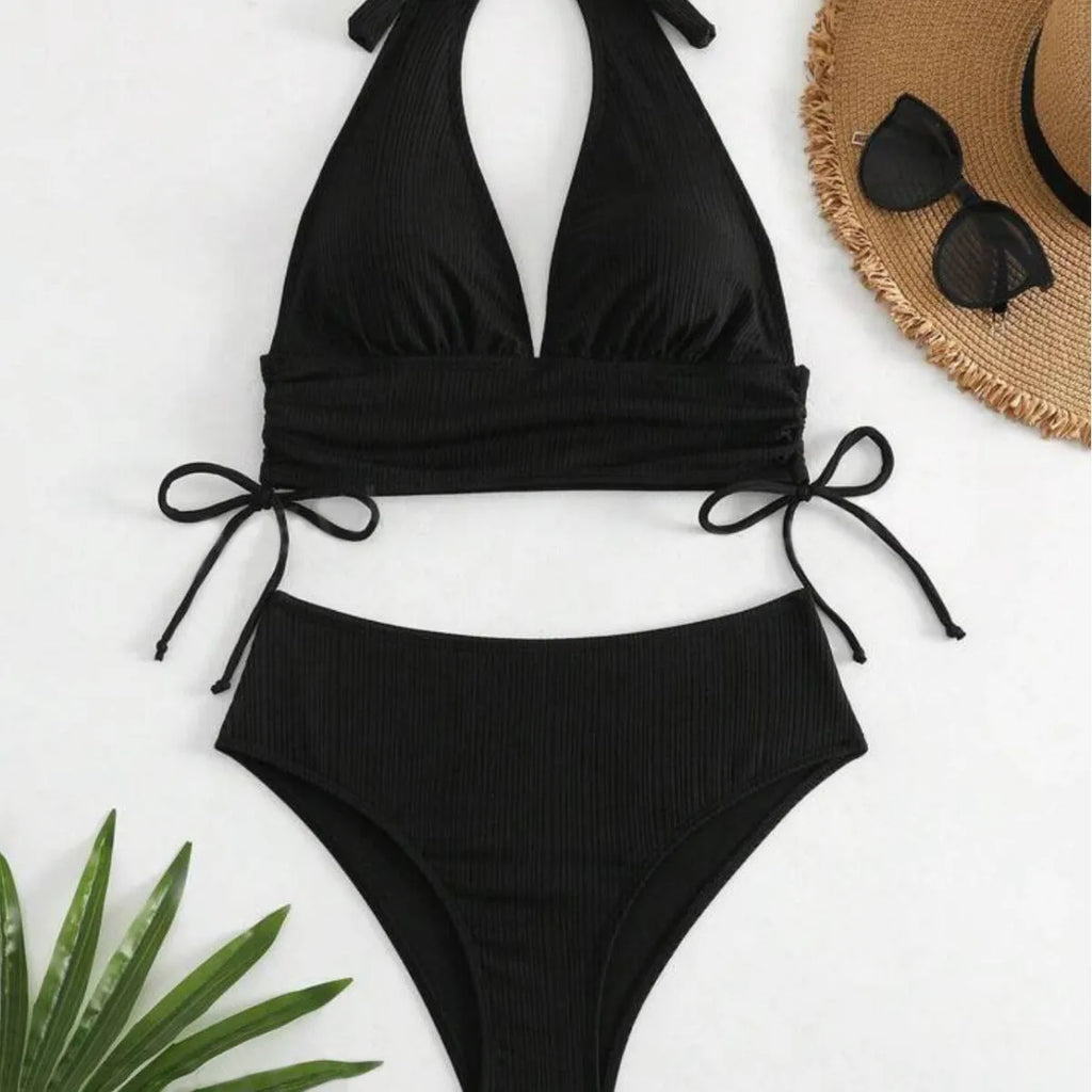 Black women's halter bikini with lace-up front detail and matching briefs.