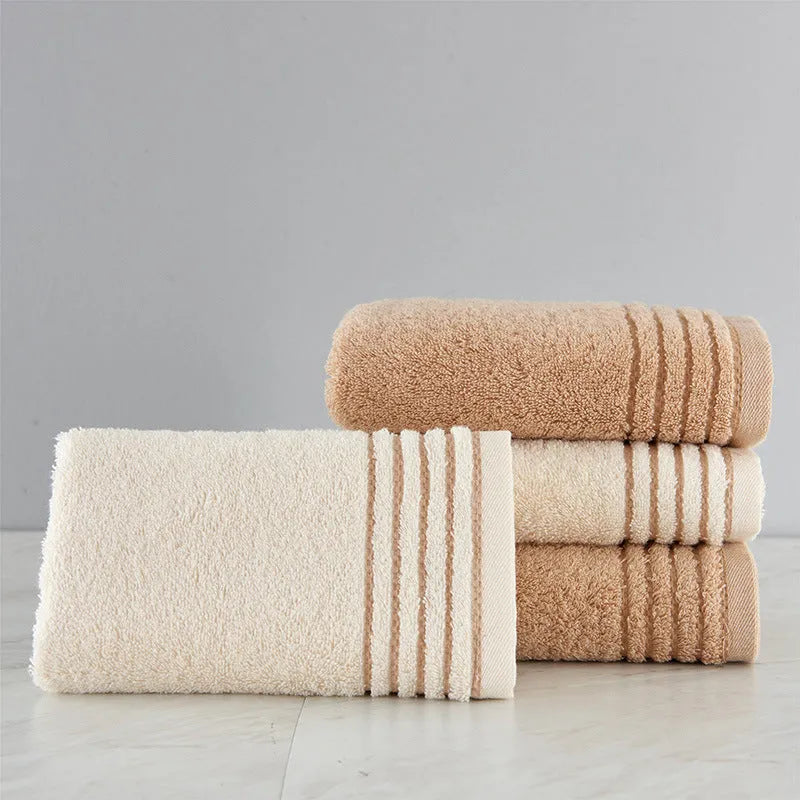 Cotton towel set showing beige and brown options with 34cm and 70cm sizes