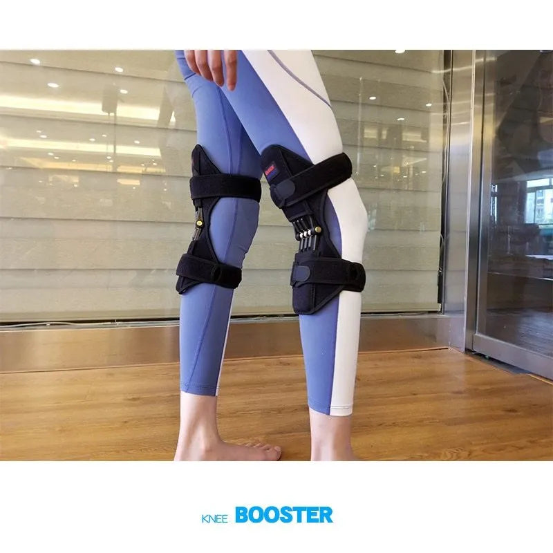 Black knee booster pair with carbon steel spring, adjustable Velcro straps, mesh ventilation and non-slip fabric, 29.5 x 28 x 27 cm