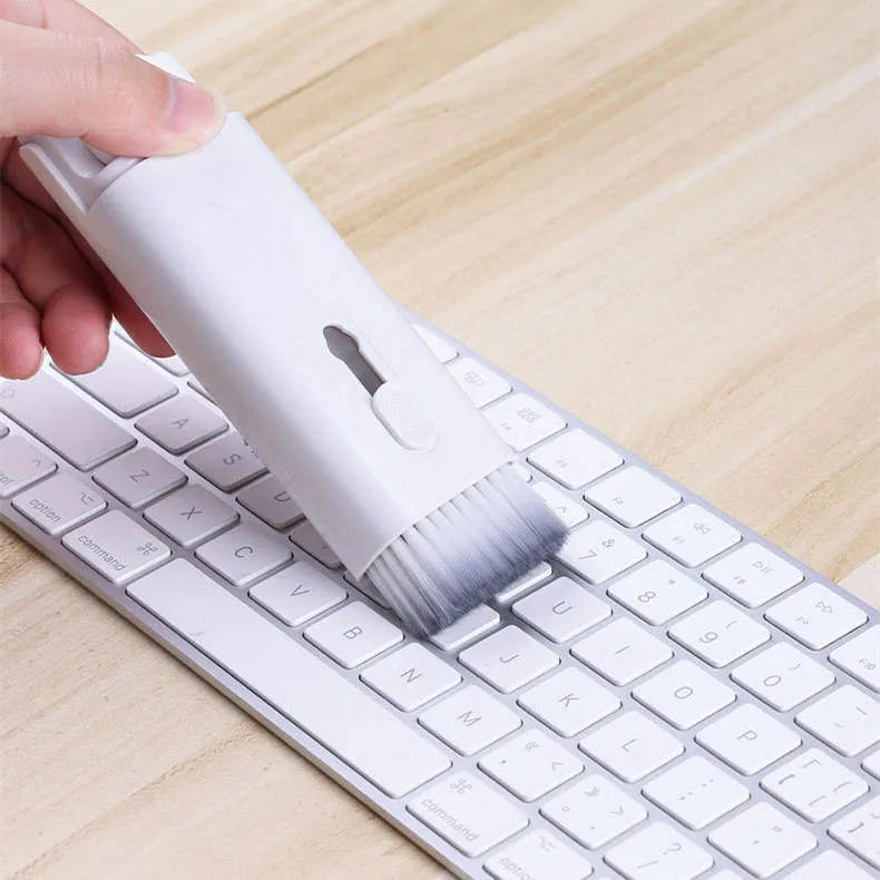 White multifunctional electronic cleaning kit with foldable pen, retractable brush, keycap puller, and spray bottle.