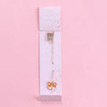 Alloy metal pendant bookmark with cartoon design choices of panda, rocket, cat paw, unicorn, and more.
