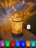 Rotating water ripple night light on solid wood base showing touch control and USB connection