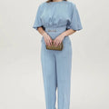 Blue men's polyester casual suit set with jacket and trousers on a hanger