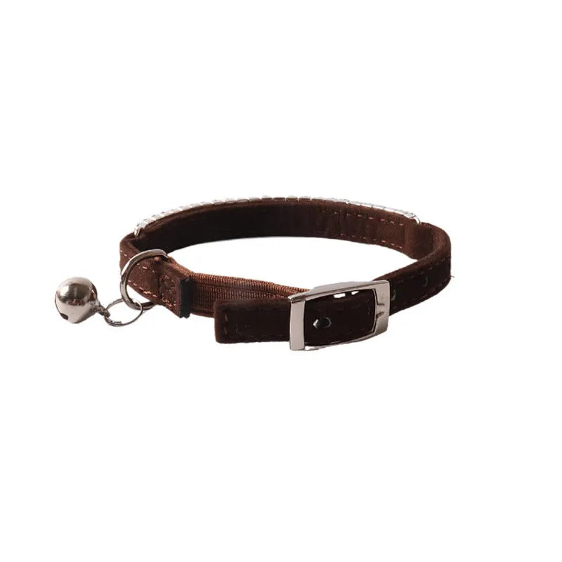 Soft flocking fabric cat collar with elastic buckle in multiple colours on a white background.