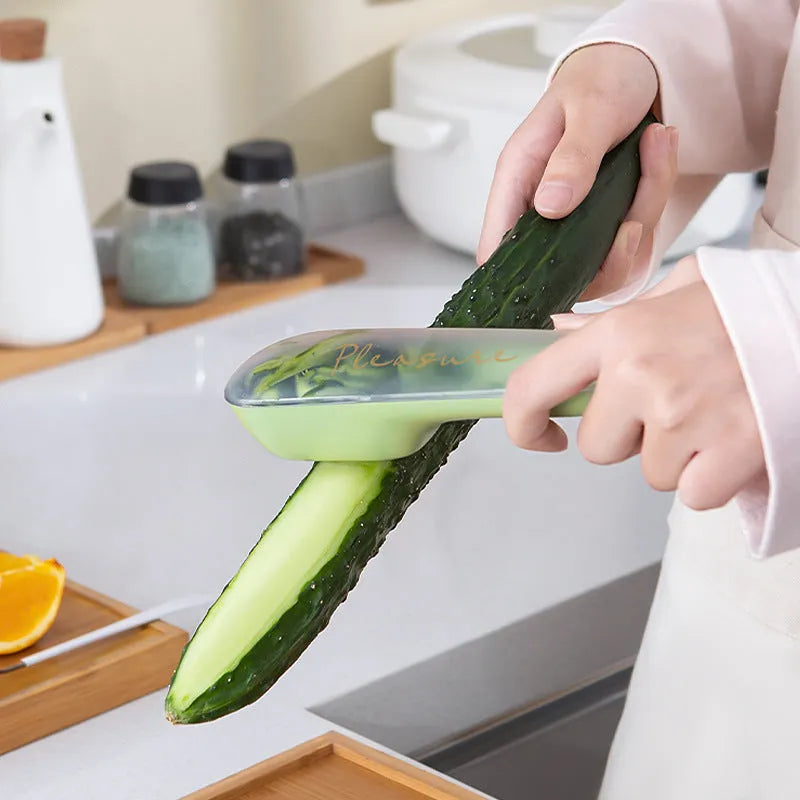 Green fruit and vegetable peeler with a stainless steel blade stored inside its own plastic tube.