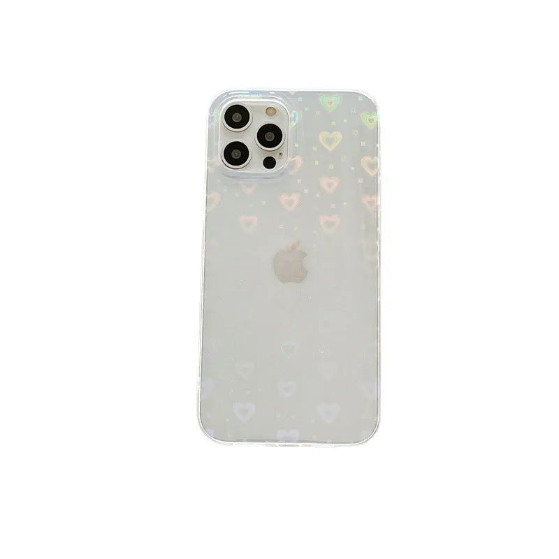 Transparent silicone iPhone case with laser-etched love heart design on a table.
