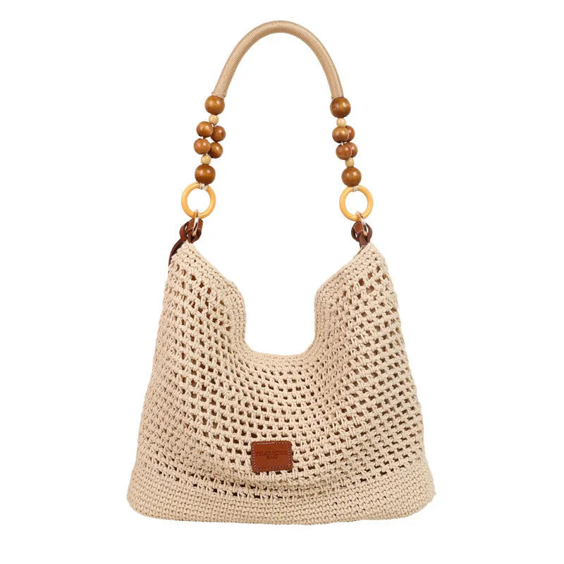 Large knitted tote beach bag with bucket shape and contrast stitching in black or brown colour options