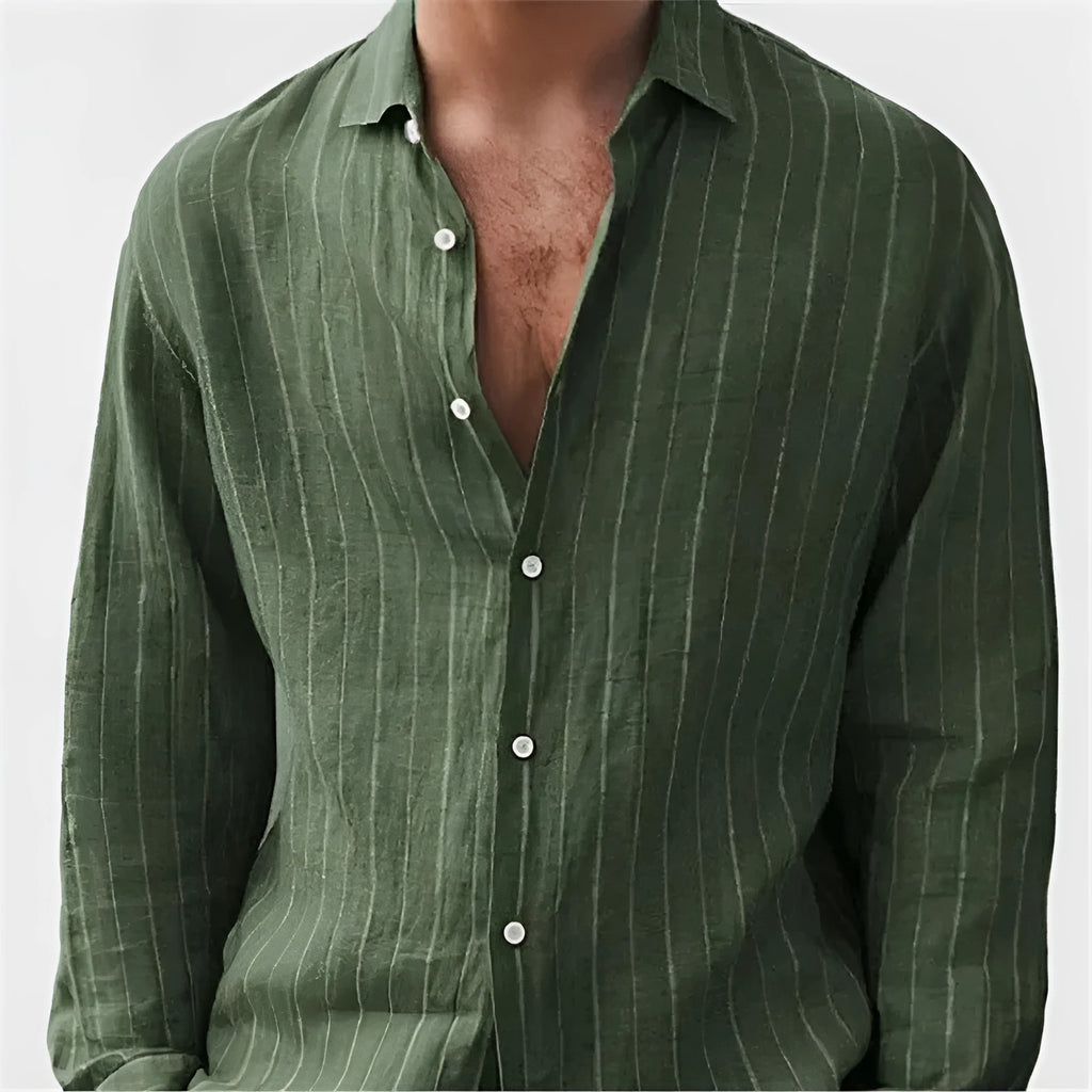 Man wearing a loose-fit striped long sleeve cardigan-style shirt in a casual setting.