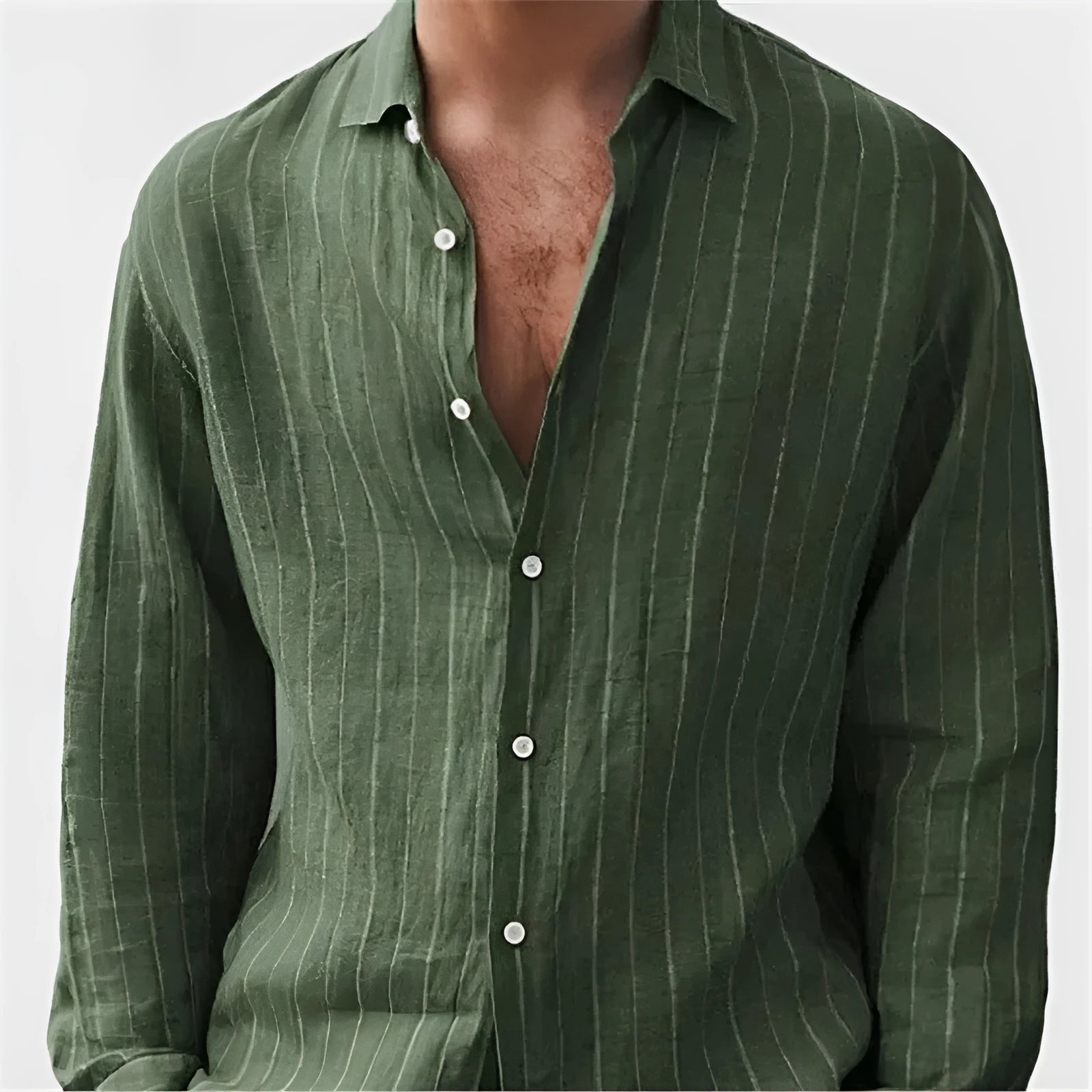 Man wearing a loose-fit striped long sleeve cardigan-style shirt in a casual setting.