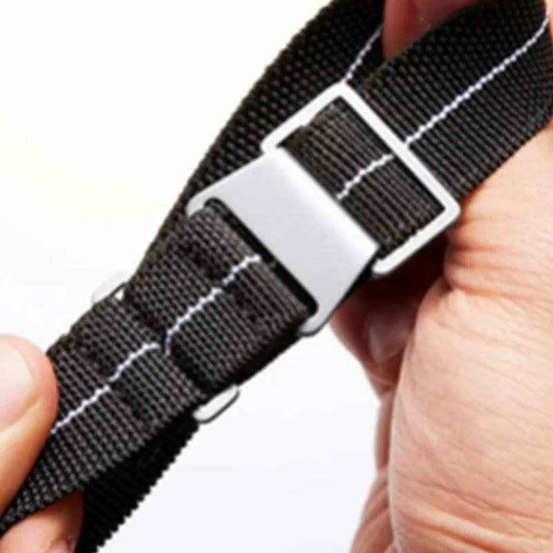 Parachute elastic nylon watchband in green and black with black buckle, 22mm width, on a wrist
