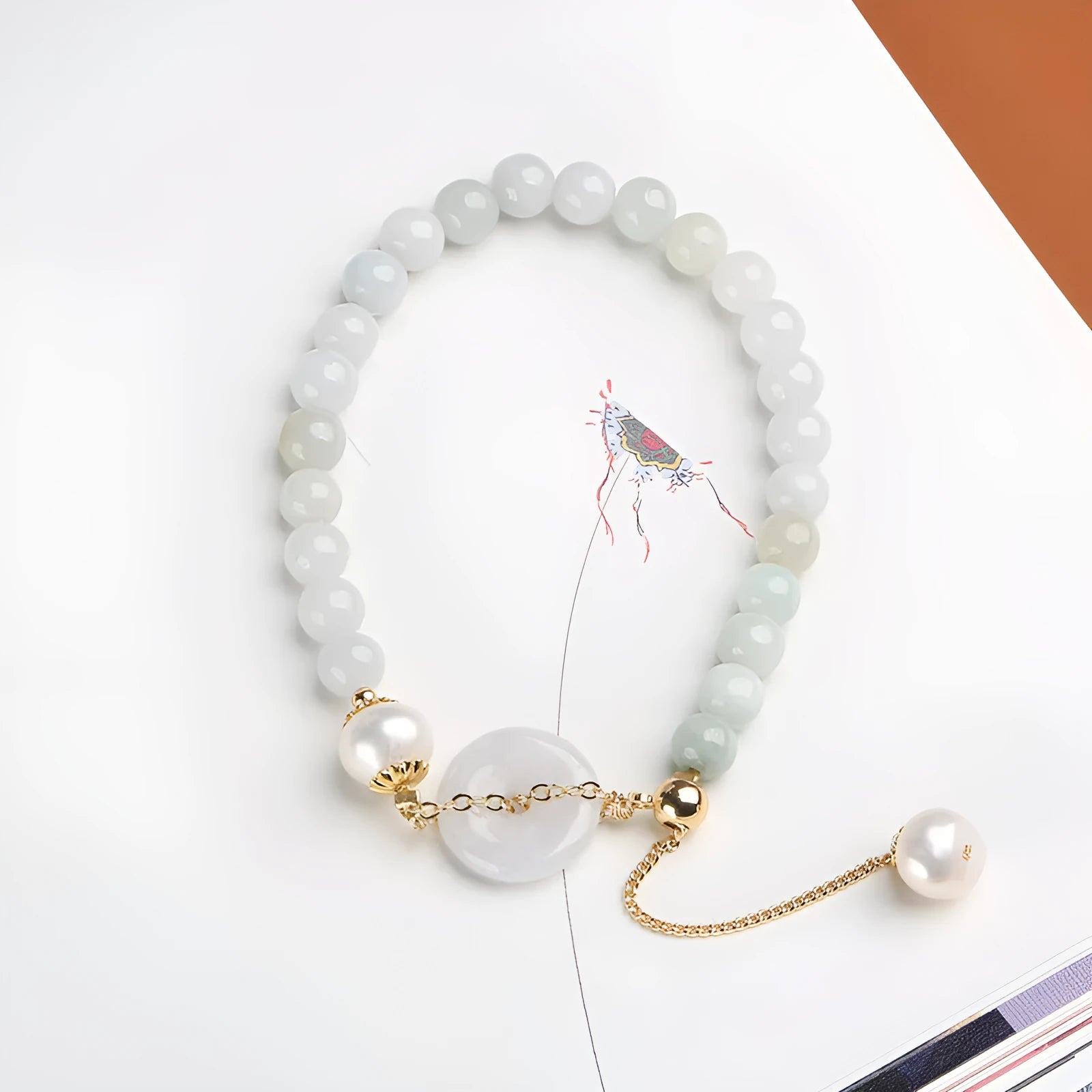 Natural emerald jade pearl bracelet with geometric peace buckle pendant and Chinese national style design