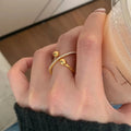 Retro brushed copper geometric planet scarf buckle ring with open mouth design on a scarf