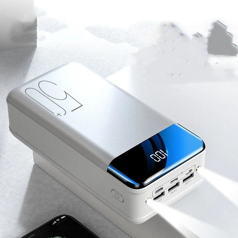 Large black and white 50000 mAh power bank showing three USB output ports