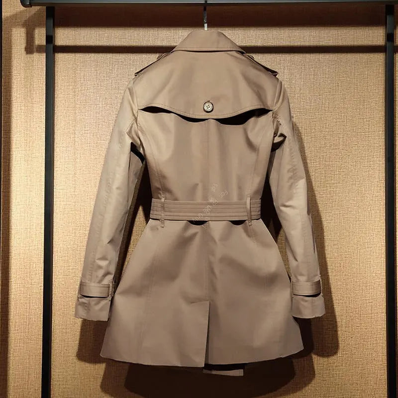 Khaki women's double-breasted polyester trench coat with flight sleeves on a hanger