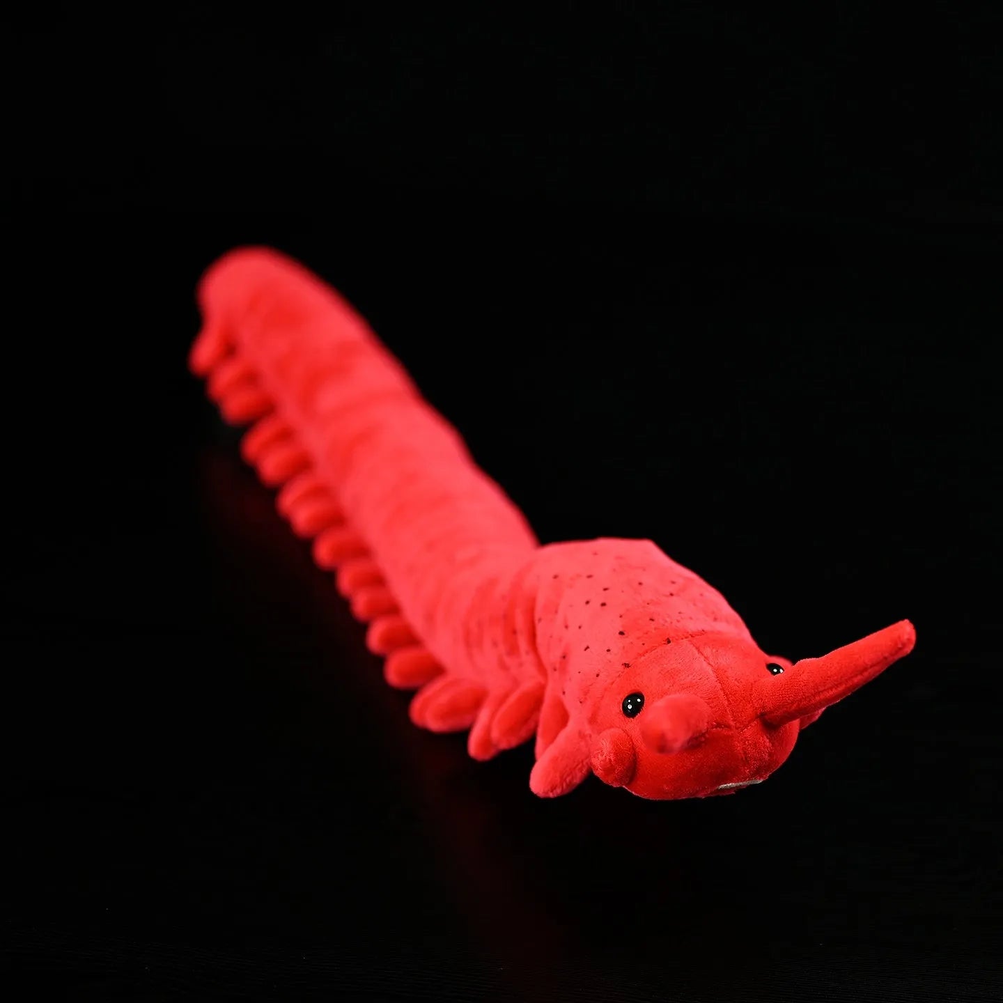 Red velvet worm plush toy silkworm doll 60cm long on a plain background