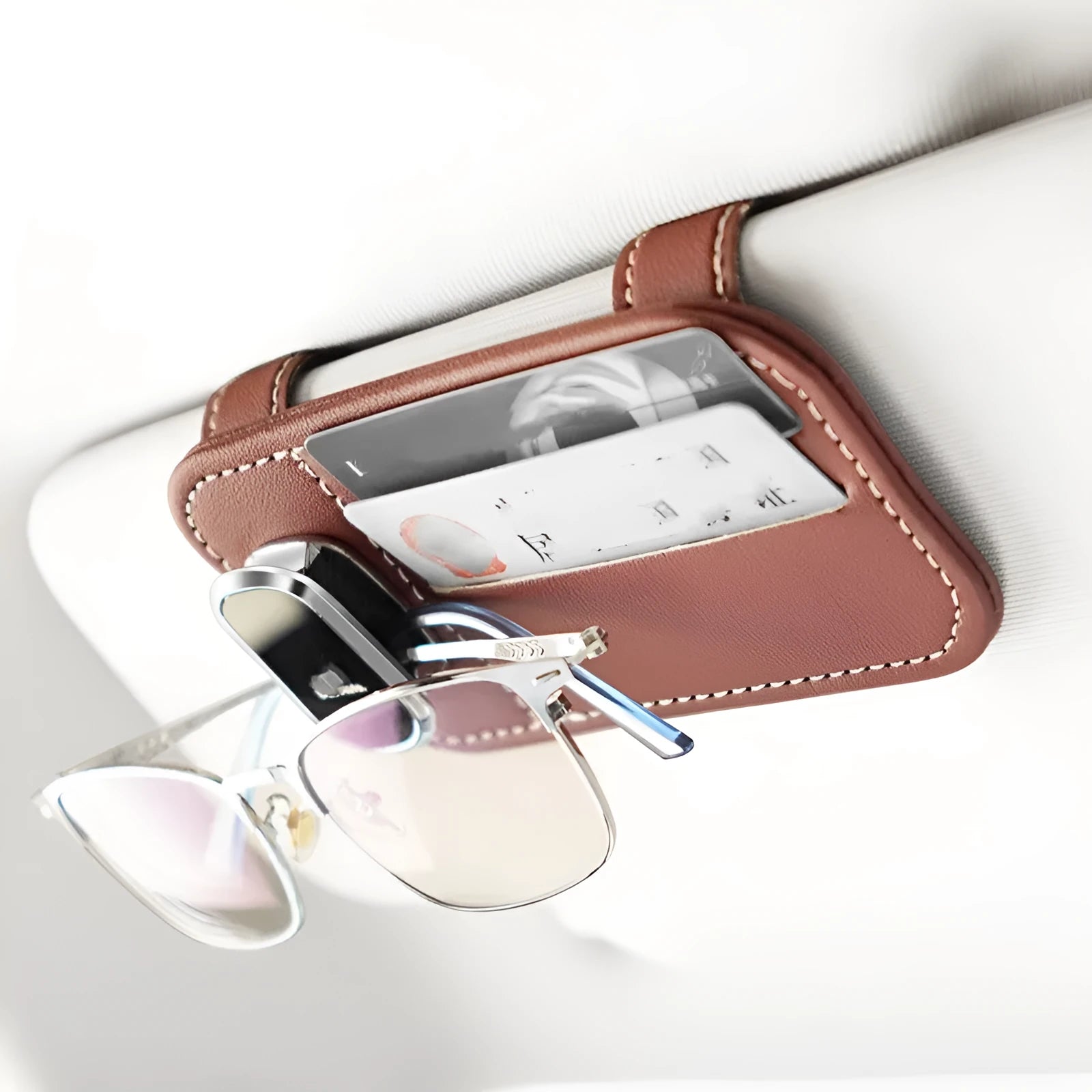 Genuine cowhide leather car sun visor holder with metal sunglasses clip and card storage slots.