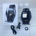 Snap-on wireless charger mobile phone holder in black finish on a desk