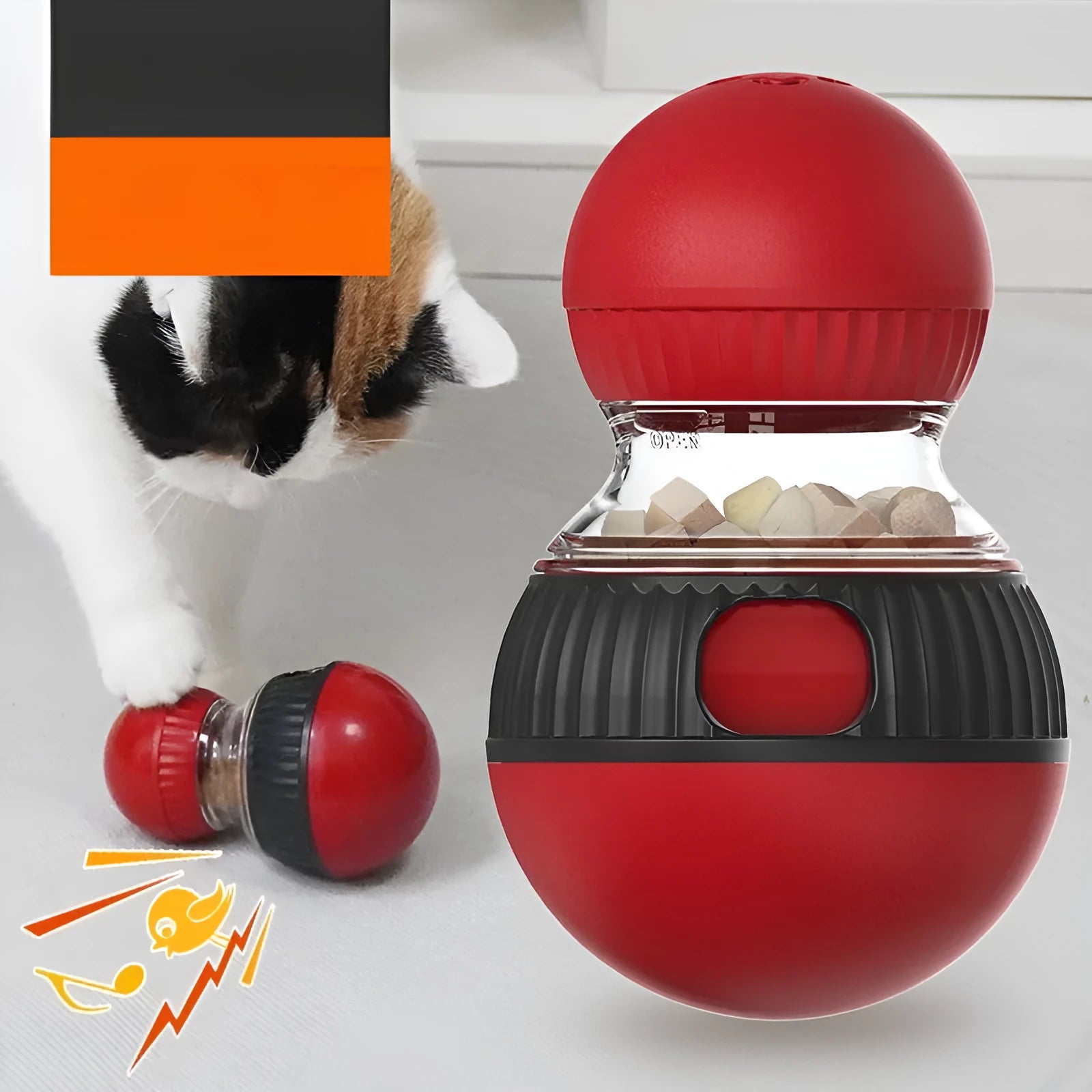 Rotating plastic cat toy with clear compartment showing super ball inside, food dispensing mechanism visible