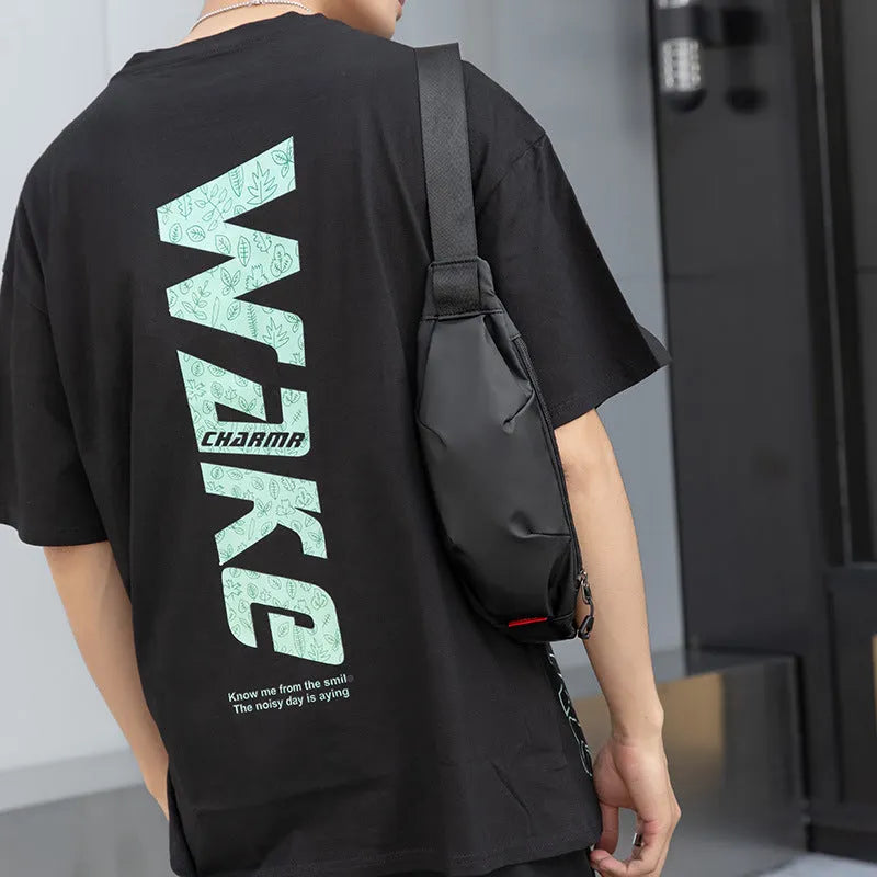 Black Oxford cloth waist pack with a phone pocket and ID pocket, shown with dimensions 12cm high by 27cm wide.