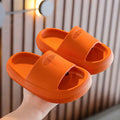 Colourful children's EVA slippers with a textured non-slip sole, shown in blue, green, orange, pink, and yellow.