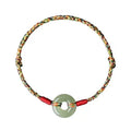 Colourful woven rope bracelet with peace buckle closure on wrist