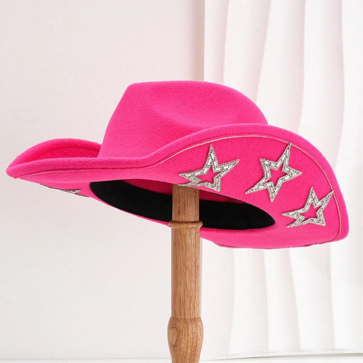 Beige polyester felt western-style top hat with a conical crown and a hexagonal star decoration on the front.