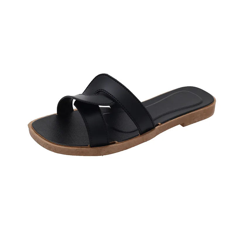 Women's PVC cross-strap toe ring sandals in light blue on a white background.