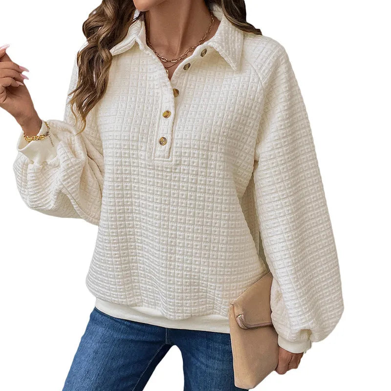 Women's milky white polo collar pullover sweater with long sleeves on a hanger.