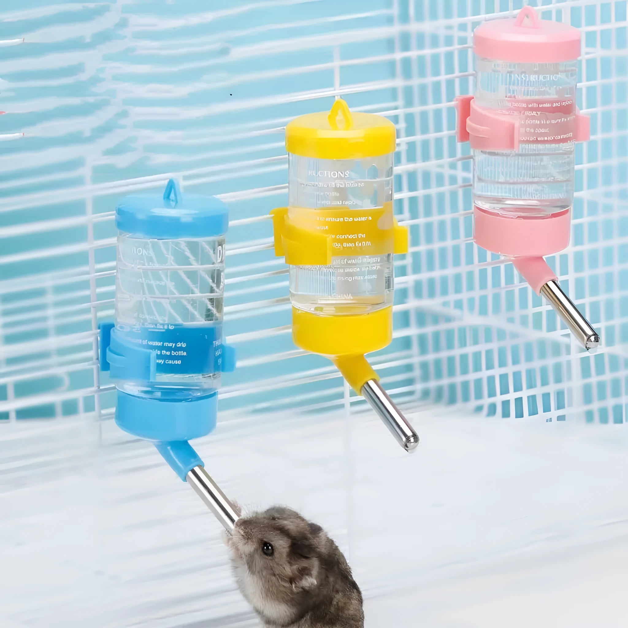 Green plastic ball kettle water feeder for pets with a leak-proof design, shown attached to a cage.