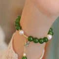 Women's natural green chalcedony bracelet with geometric design and round elements