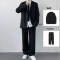Plus size men in a navy college style suit set with white shirt and tie, showing loose fit.
