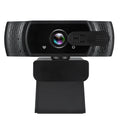 Black USB webcam with built-in microphone mounted on a laptop screen