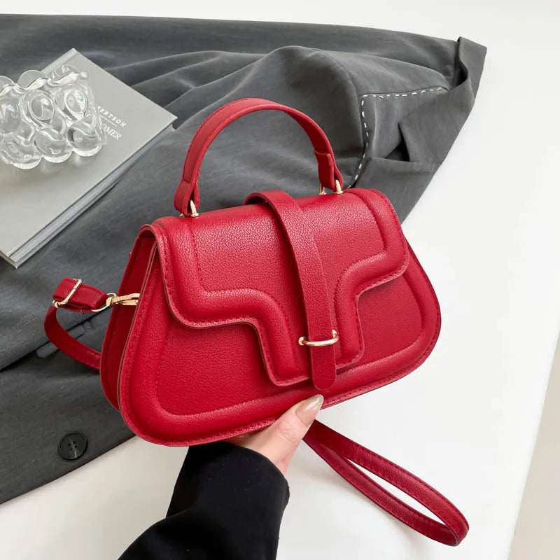 Simple PU shoulder bag in black, white or red with single strap and horizontal square shape.
