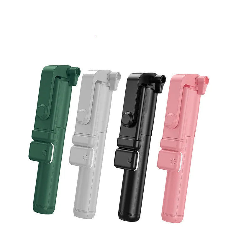 Black Bluetooth selfie stick with extended tripod legs holding a smartphone.
