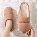 Blue down cotton slippers with artificial leather uppers, thick rubber soles, and plush lining for indoor winter wear.