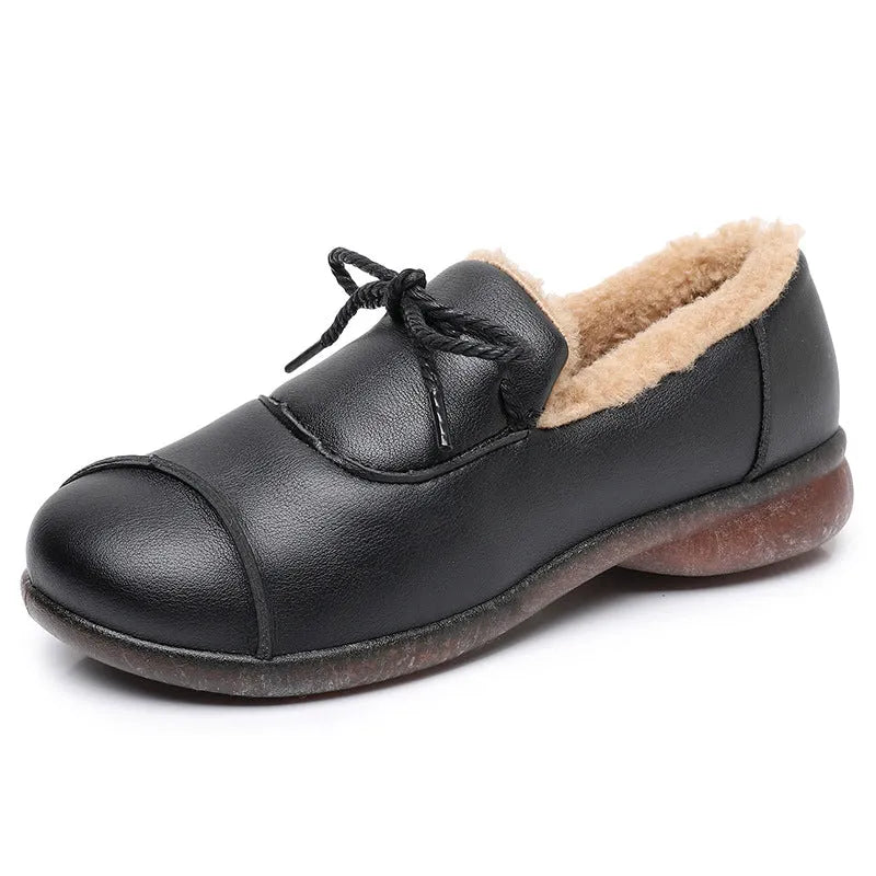 Black flat non-slip slip-on fleece-lined warm shoes with microfiber upper and round toe