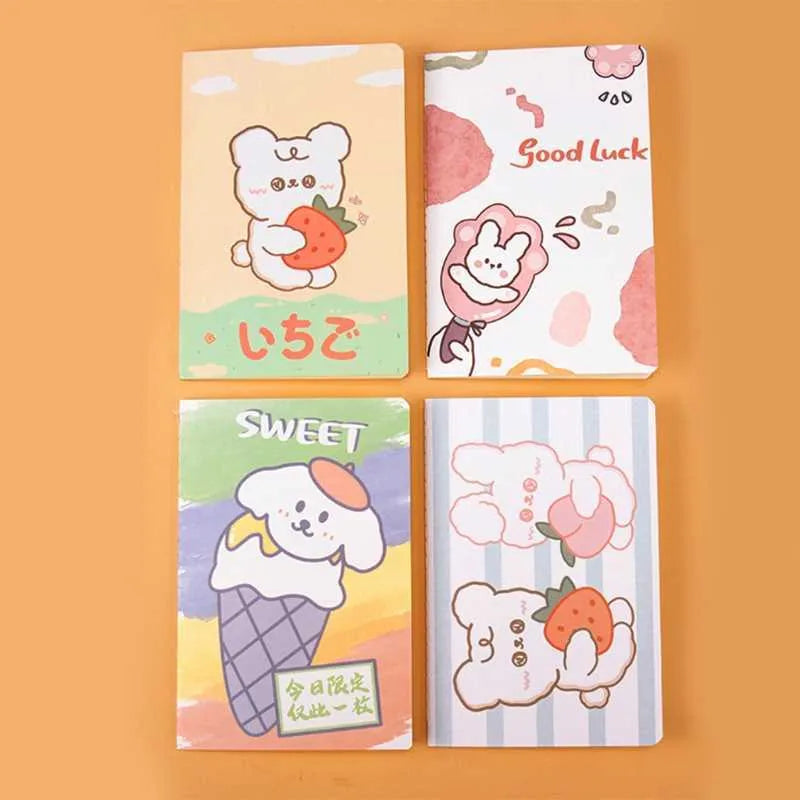 Colourful cartoon A5 notebook with 30 sheets, showing Strawberry Rabbit and Kumamoto Rabbit design options.