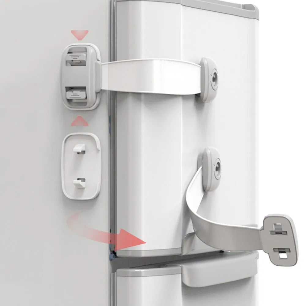 Grey adjustable child safety strap lock with adhesive pads, shown securing a kitchen cabinet door.