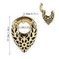 Stainless steel drop-shaped auricle ear extender with totem design on a white background.
