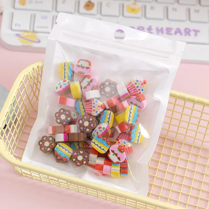 Assortment of 50 small colourful cartoon fruit and animal themed TPR rubber mini erasers.
