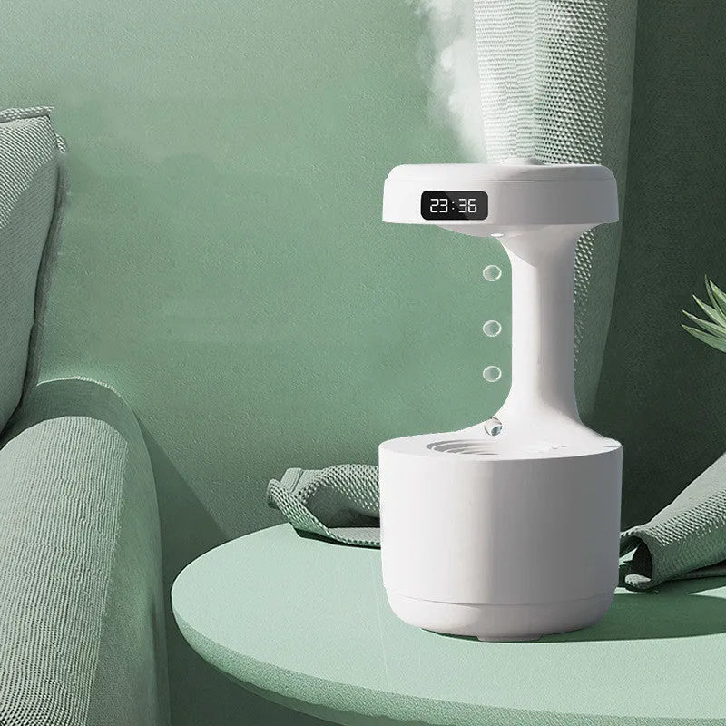 Bedroom anti-gravity humidifier with clock and backflow aroma diffuser in white plastic on desk with LED display