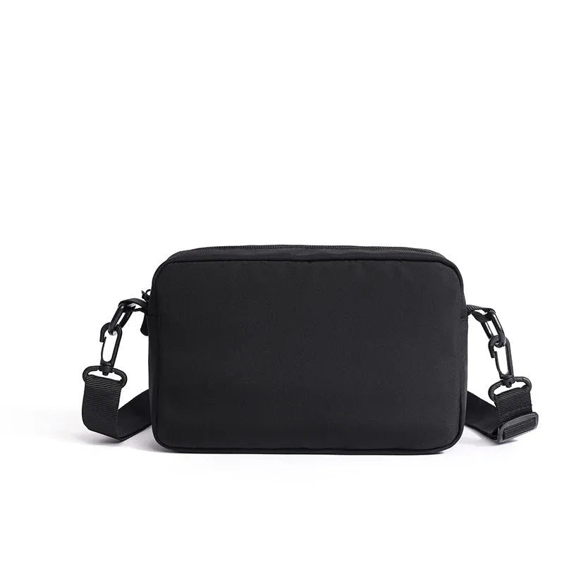 Men's lightweight nylon shoulder bag in black with messenger style for student travel and business use