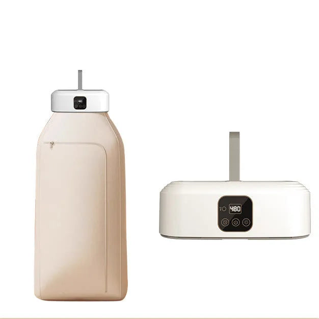 White cylindrical laundry dryer with remote control on countertop showing compact 29cm height