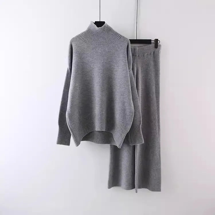 Women's milky white acrylic fibre sweater and wide-leg trousers two-piece casual set on a hanger.