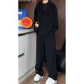 Men's black casual two-piece set with long sleeve polo shirt and matching trousers in slim fit design
