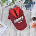 Red V-spliced winter coat on dog showing thick fabric construction and casual styling